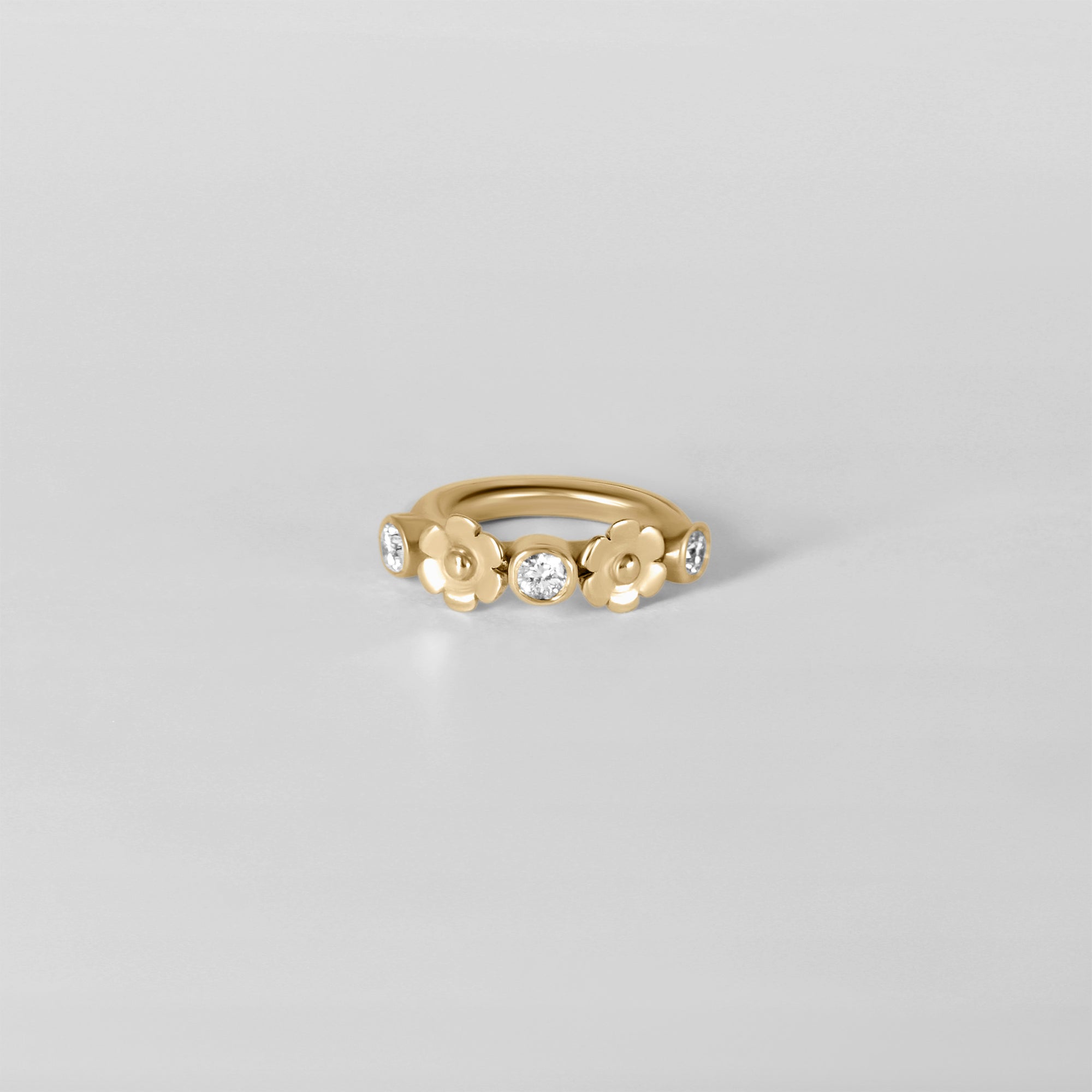 Detail of Anneau Baya hoop piercing, sleek yellow gold finish handmade in Paris