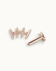 Rose gold piercing jewelry with geometric spikes and tiny stones, handmade luxury body adornment