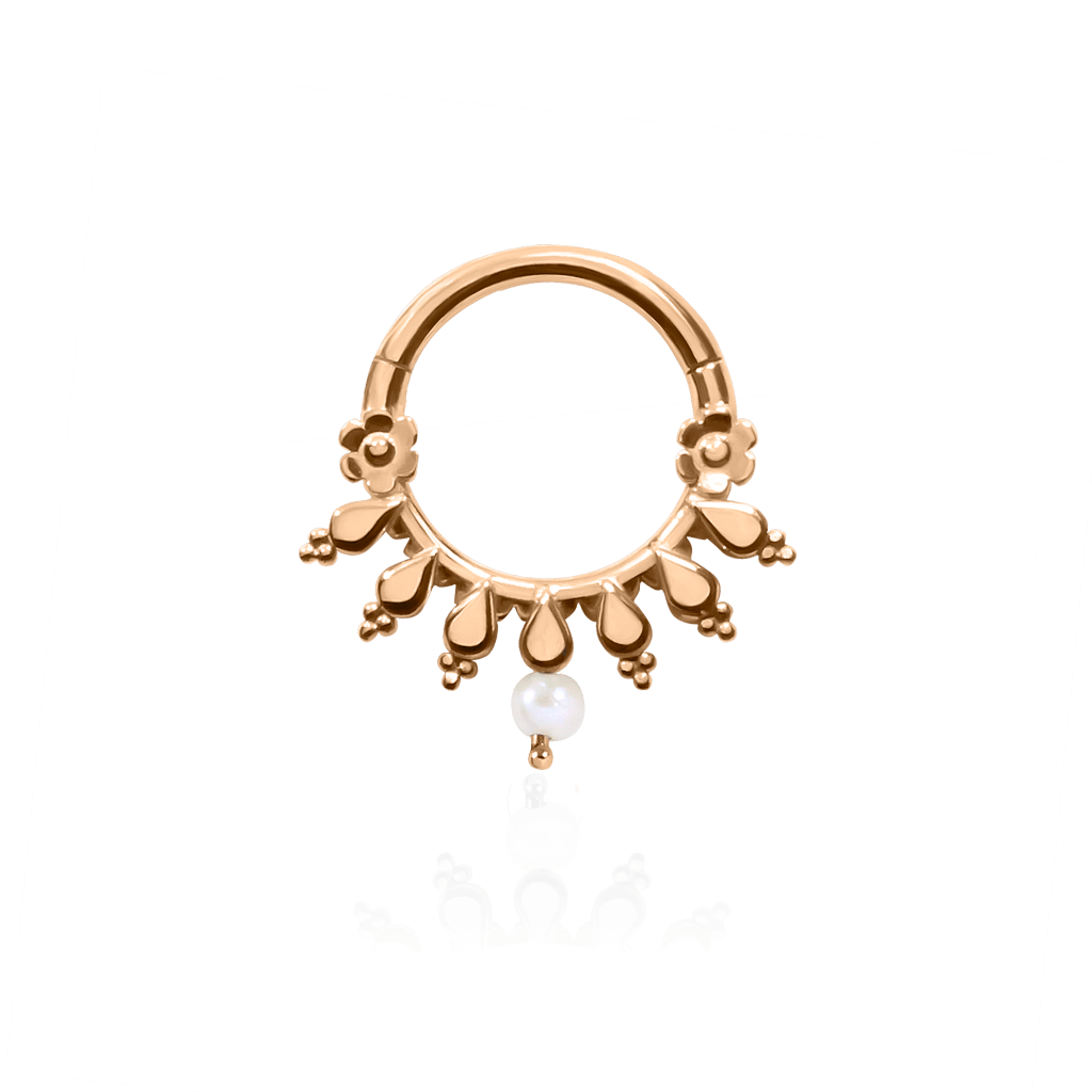 Front-facing 18k rose gold piercing ring with radiant details with pearl
