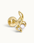 18k gold piercing stud featuring a pearl and diamond in a curved leaf design