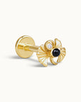 18k gold piercing stud with a decorative black stone and diamond accent