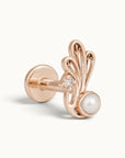 Rose gold piercing stud with a white pearl, small diamond, and ornate filigree design.