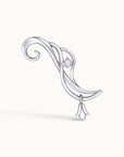 Silver swirl ear piercing jewelry with a diamond and floral drop charm