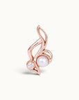 18k rose gold piercing jewelry featuring a pearl and a diamond