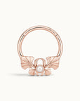 18k rose gold hoop piercing jewelry with a pearl and shell design