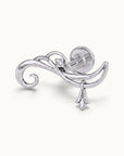 Elegant white gold swirl cartilage piercing with a small diamond and floral charm