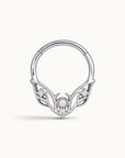 Silver septum ring with an ornate wing design, featuring a central pearl and small diamonds