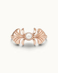 Rose gold sculpted ring with a central white pearl