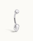 Elegant 18k gold navel piercing with pearl and leaf design, luxury body jewelry for timeless style