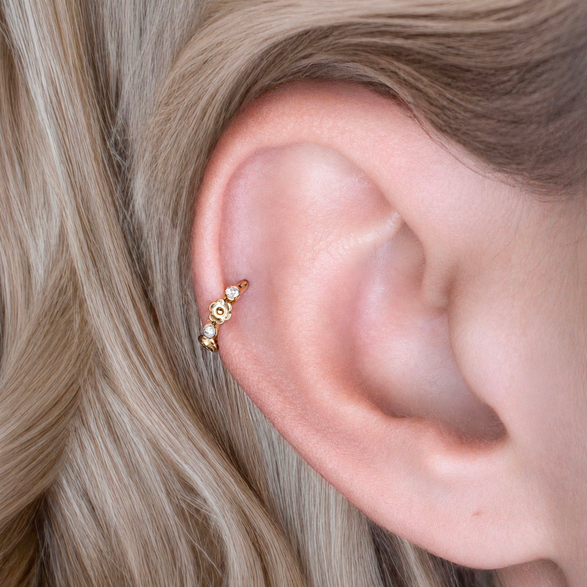 18k gold ear cuff with floral design and clear stones, elegant piercing jewelry for women