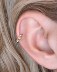 18k gold ear cuff with floral design and clear stones, elegant piercing jewelry for women