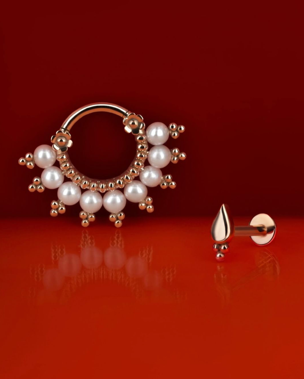 18k gold piercing jewelry with pearls on a red background, luxury handmade design