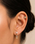 18k gold ear piercing jewelry with baguette and round diamonds, elegant luxury body jewelry for ear