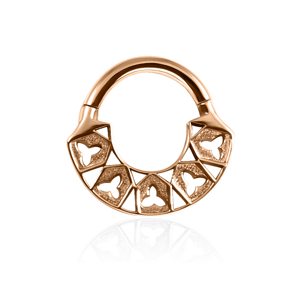 Front-facing 18k rose gold piercing ring with gothic details 