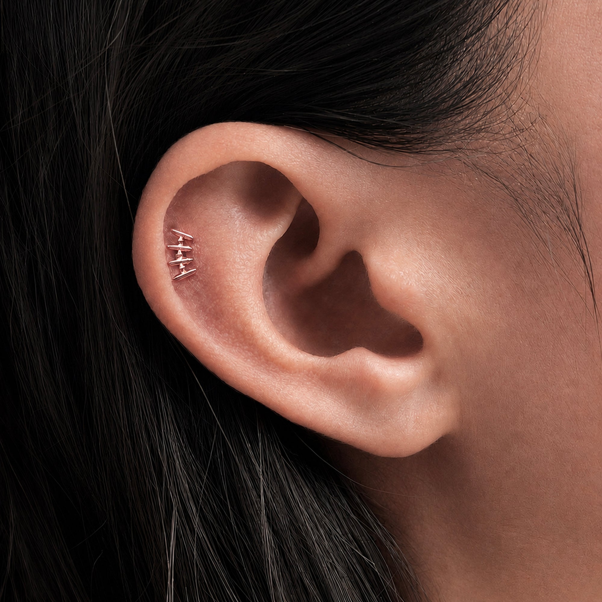 Delicate 18k gold ear piercing jewelry with geometric design, showcasing elegant body jewelry for a timeless look.