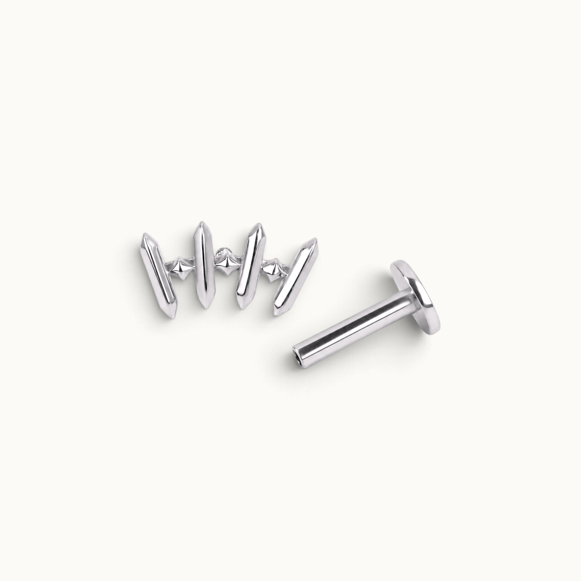 18k gold piercing jewelry with geometric design and small gem accents, ideal for ear or nose piercings