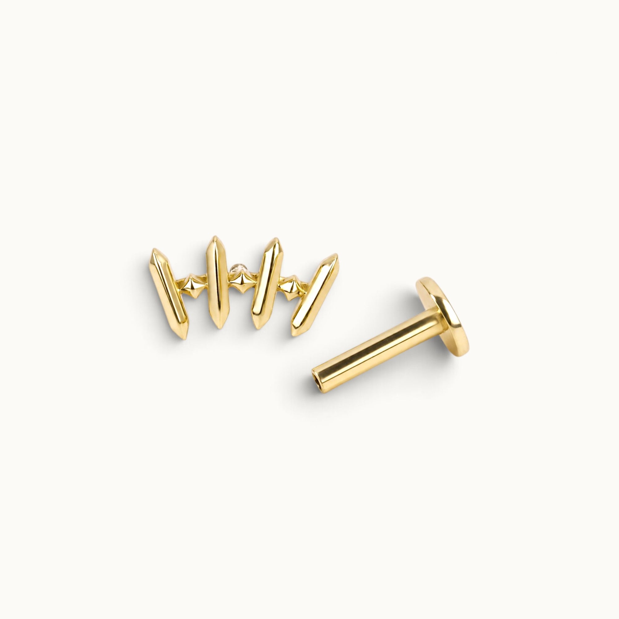 18k gold ear piercing jewelry with geometric spikes and diamond accents, handmade luxury body jewelry