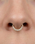 18k gold septum piercing with pave set sparkling white stones on nose