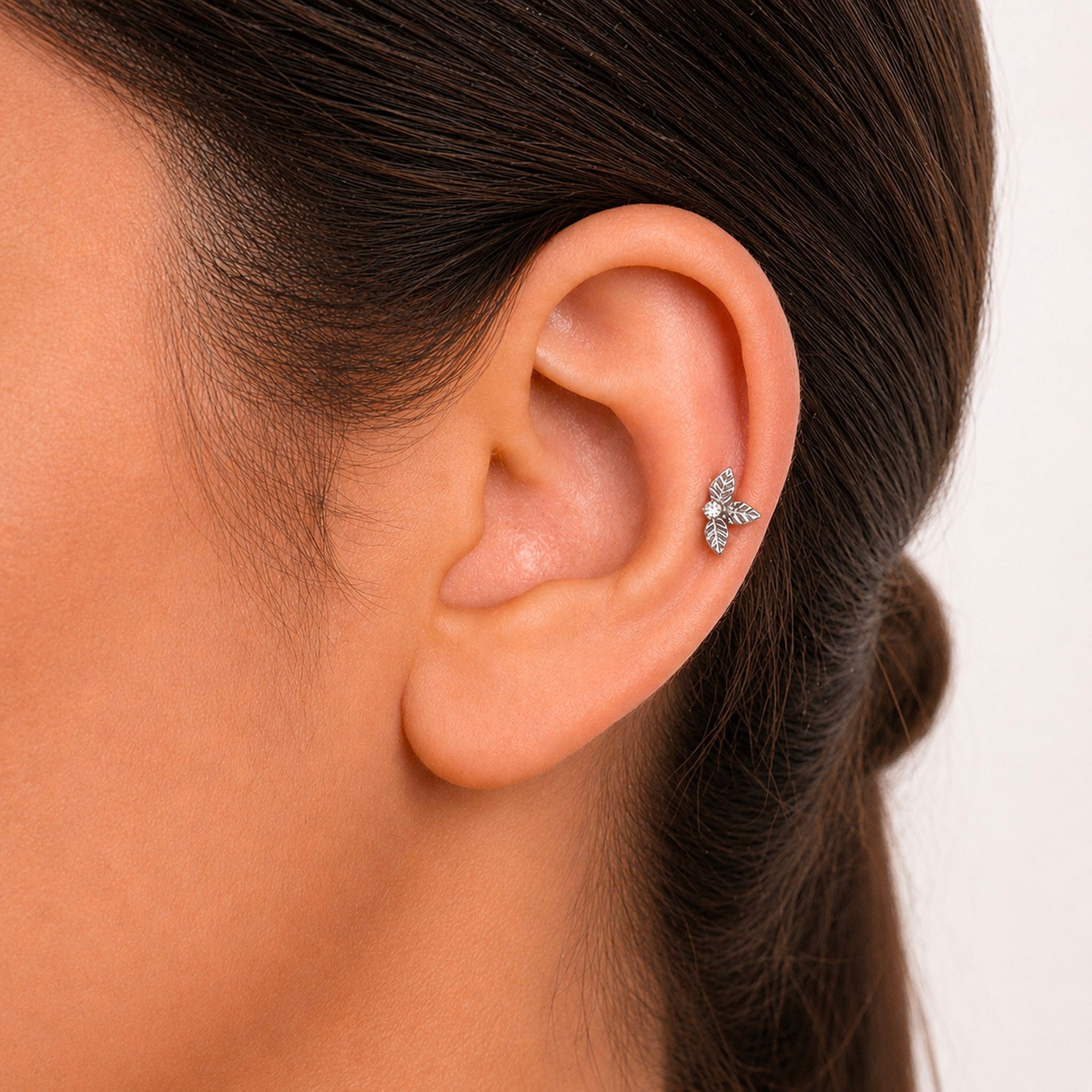 Delicate leaf-shaped ear piercing with diamond accent, luxury 18k gold body jewelry for elegant style
