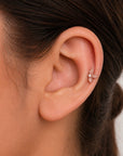 Delicate rose gold leaf ear piercing with diamond accent, luxury 18k gold jewelry for elegant style