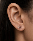Rose gold snake ear piercing with diamond eye, luxury 18k gold body jewelry for elegant style
