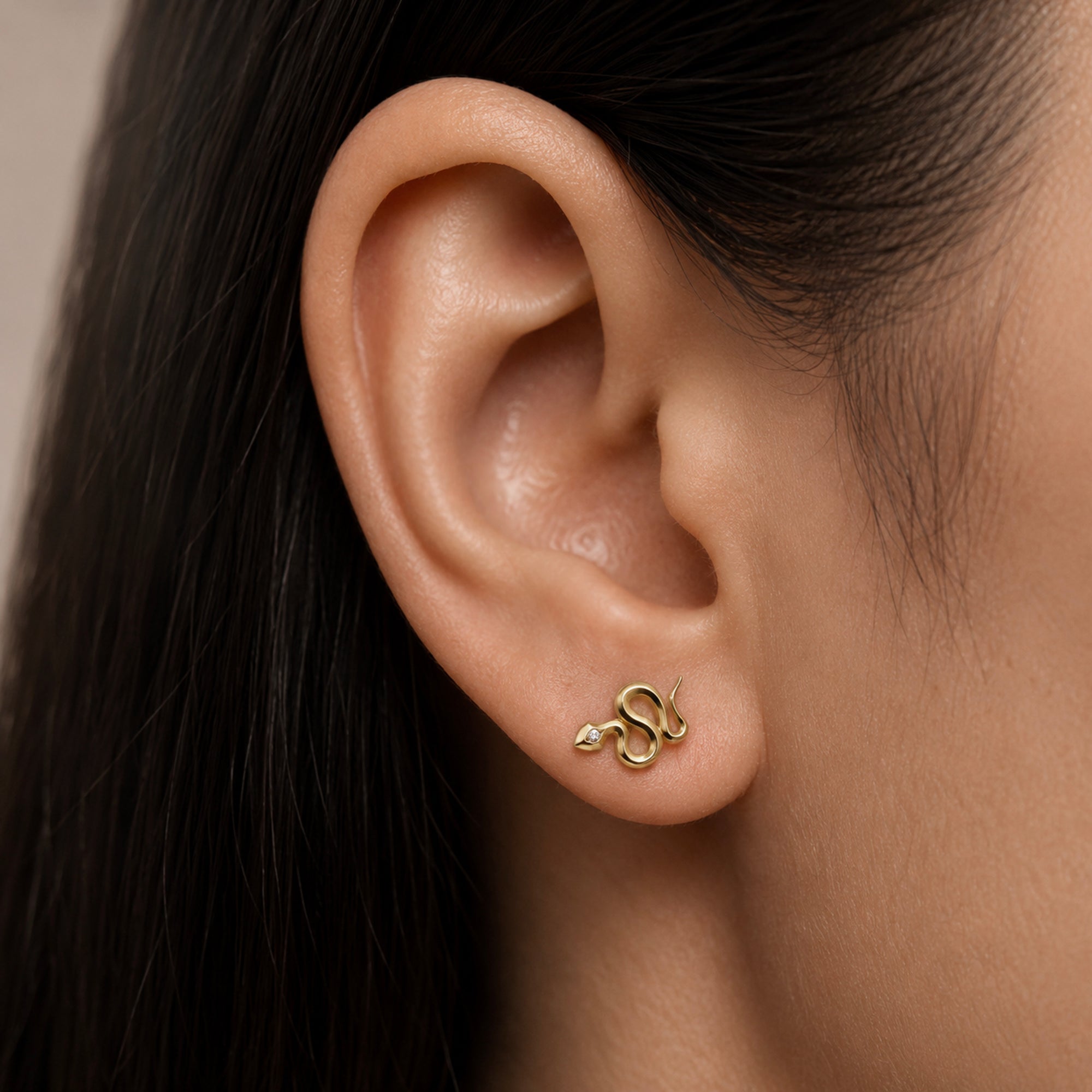18k gold snake ear piercing with diamond eye, luxury body jewelry for elegant style