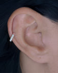 Woman wearing Luméa Ring Piercing in 18k gold with freshwater pearls – modern heirloom style