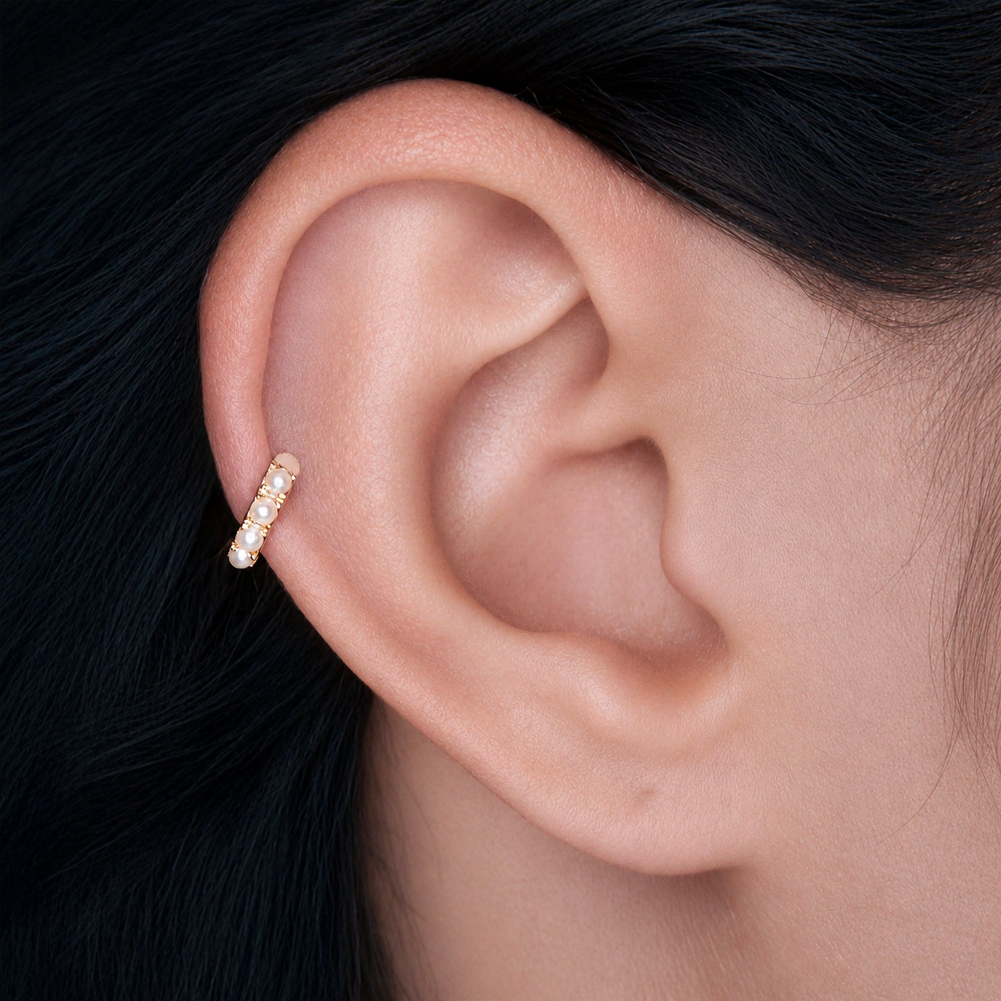 18k gold ear piercing with delicate pearls, luxury body jewelry for elegant style