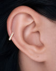 18k gold ear piercing with delicate pearls, luxury body jewelry for elegant style