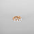 Close up of the Luméa hoop piercing in 18k rose gold adorned with freshwater pearls