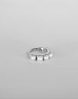 Close up for the Luméa hoop piercing, handcrafted in Paris in 18k white gold with pearls