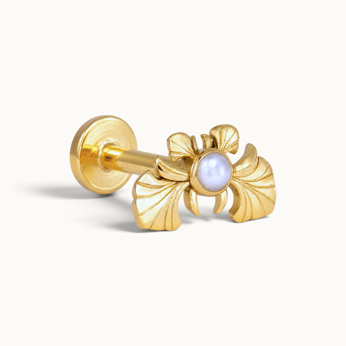 18k gold piercing stud with an ornate wing design and a central white pearl