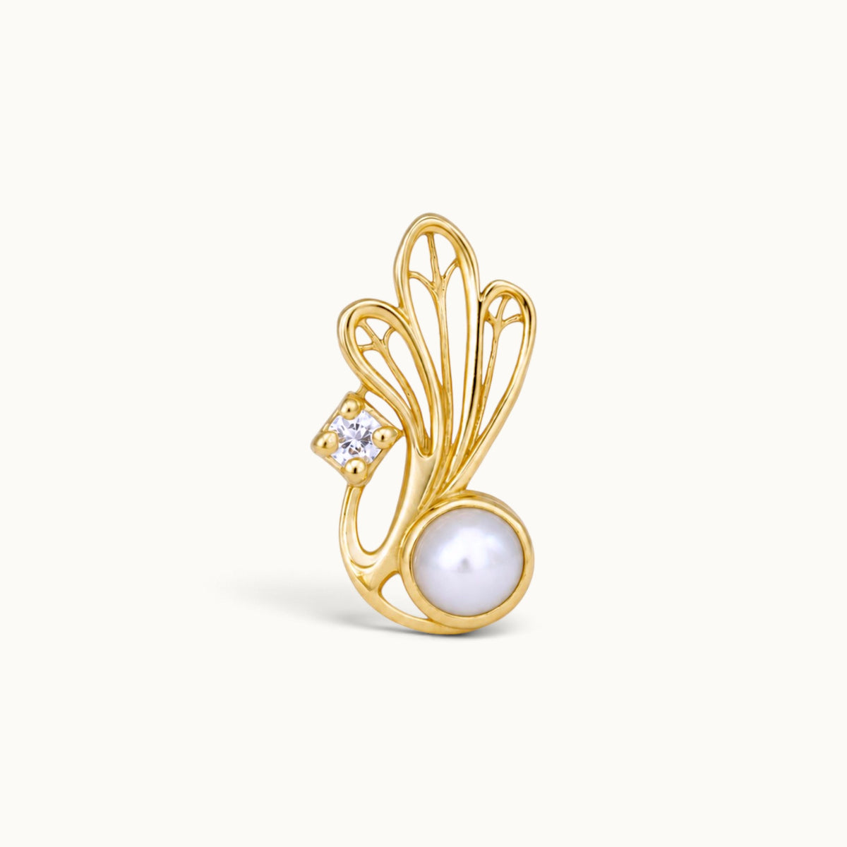 18k gold piercing stud featuring a white pearl, a diamond, and an ornate wing design