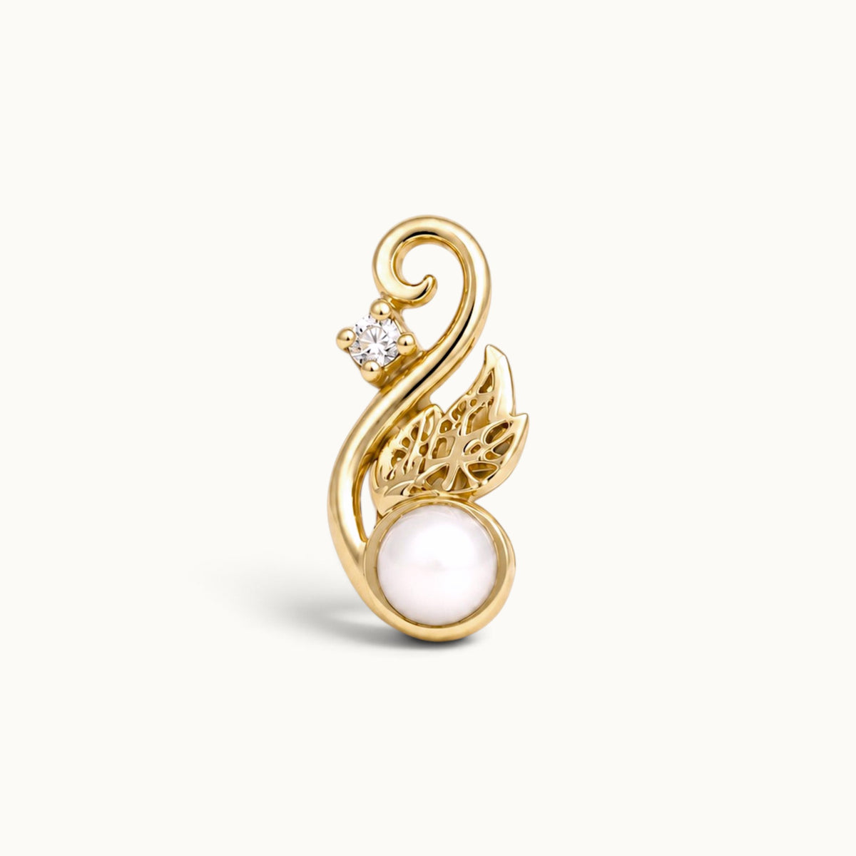 18k gold swirling leaf piercing jewelry with a white pearl and a diamond