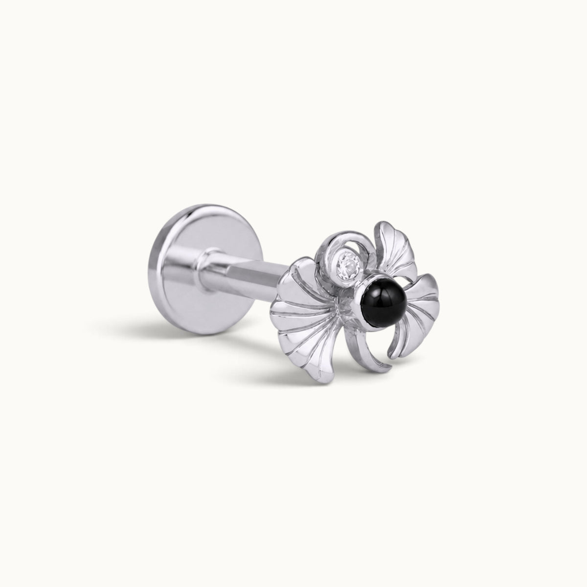 Silver shell-shaped piercing stud with a black gemstone and diamond accent