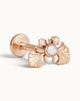 Rose gold ginkgo leaf piercing stud with a central white pearl
