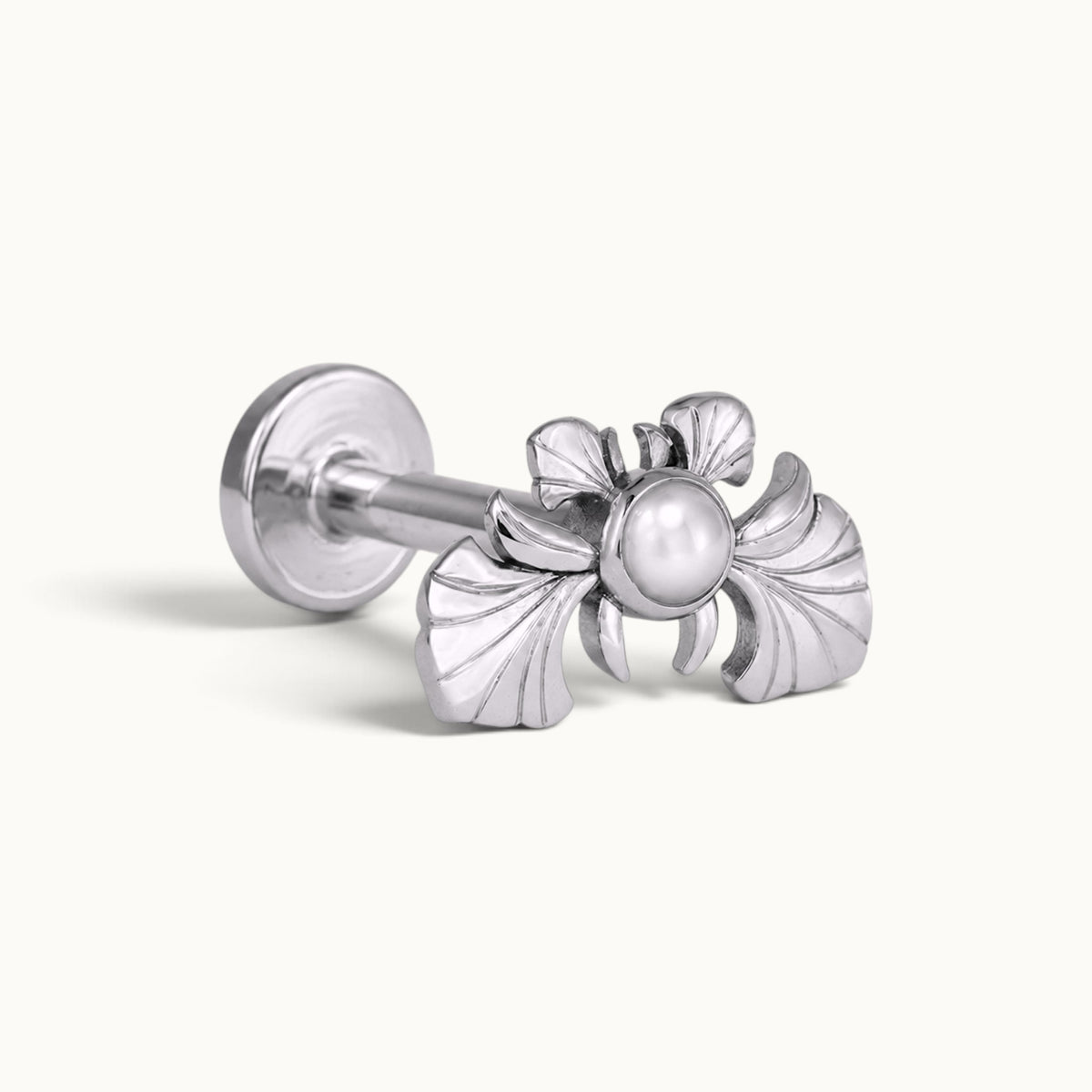 Silver piercing stud featuring a pearl and ornate wing design