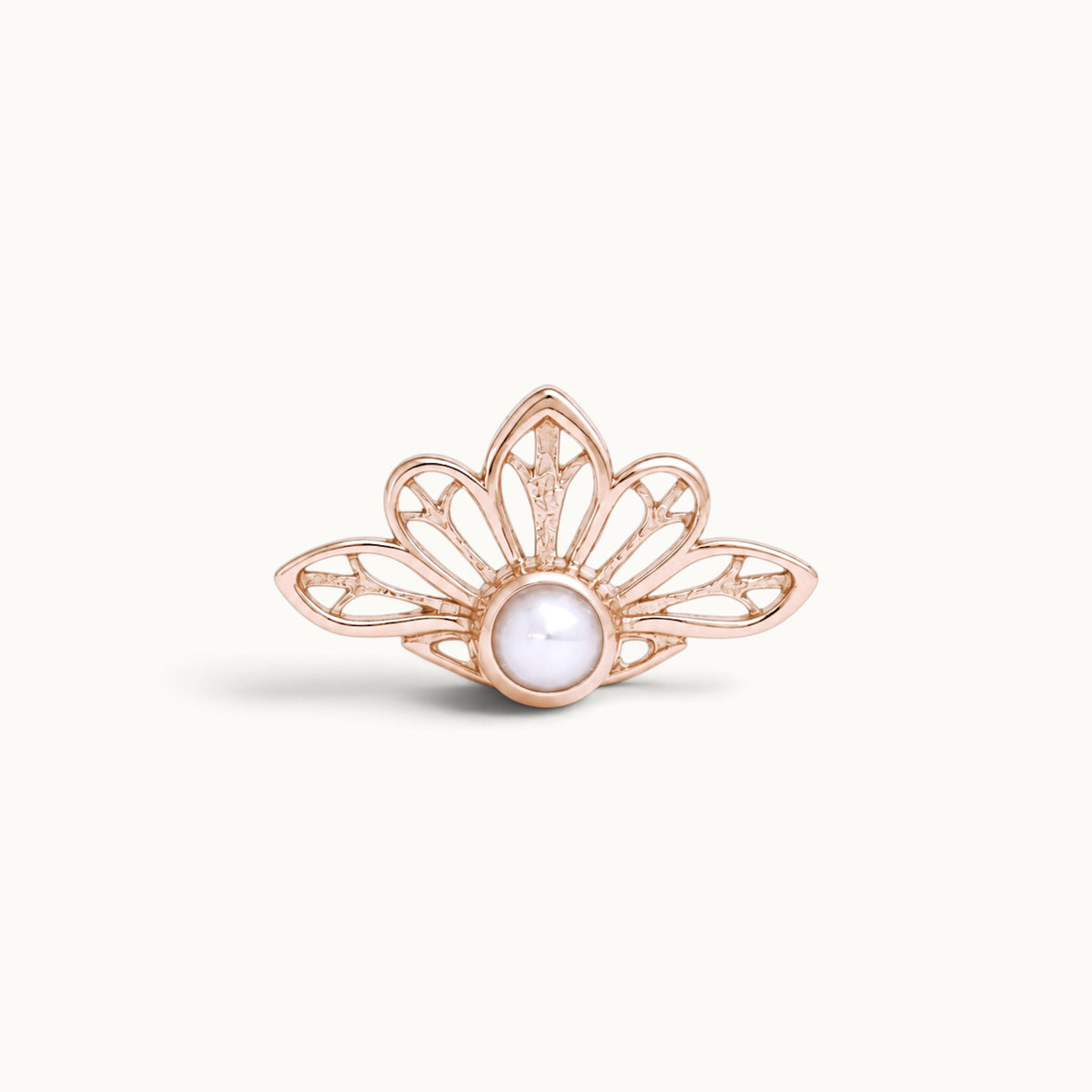 Rose gold crown-shaped piercing jewelry with a center white pearl on a white background
