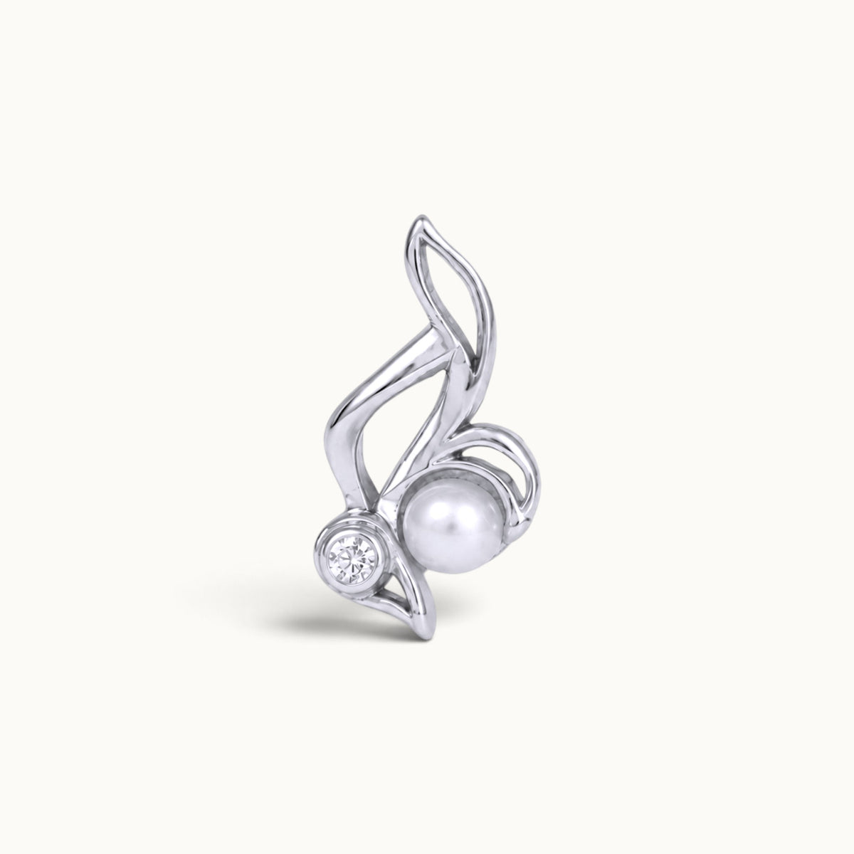 Elegant white gold piercing jewelry with a white pearl and a sparkling diamond