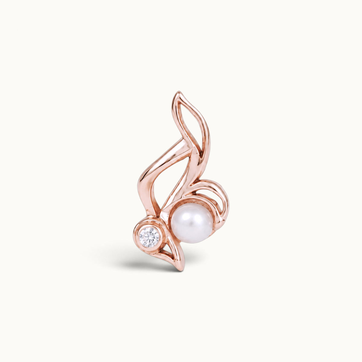 18k rose gold piercing jewelry featuring a pearl and a diamond