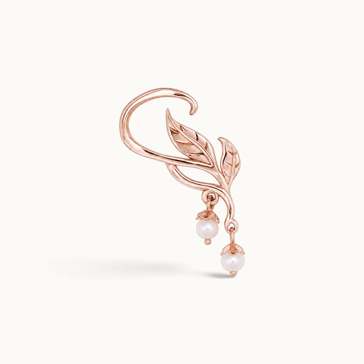 Rose gold ear cuff with leaf design and dangling pearls