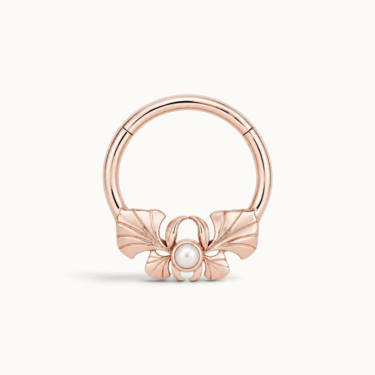 18k rose gold hoop piercing jewelry with a pearl and shell design
