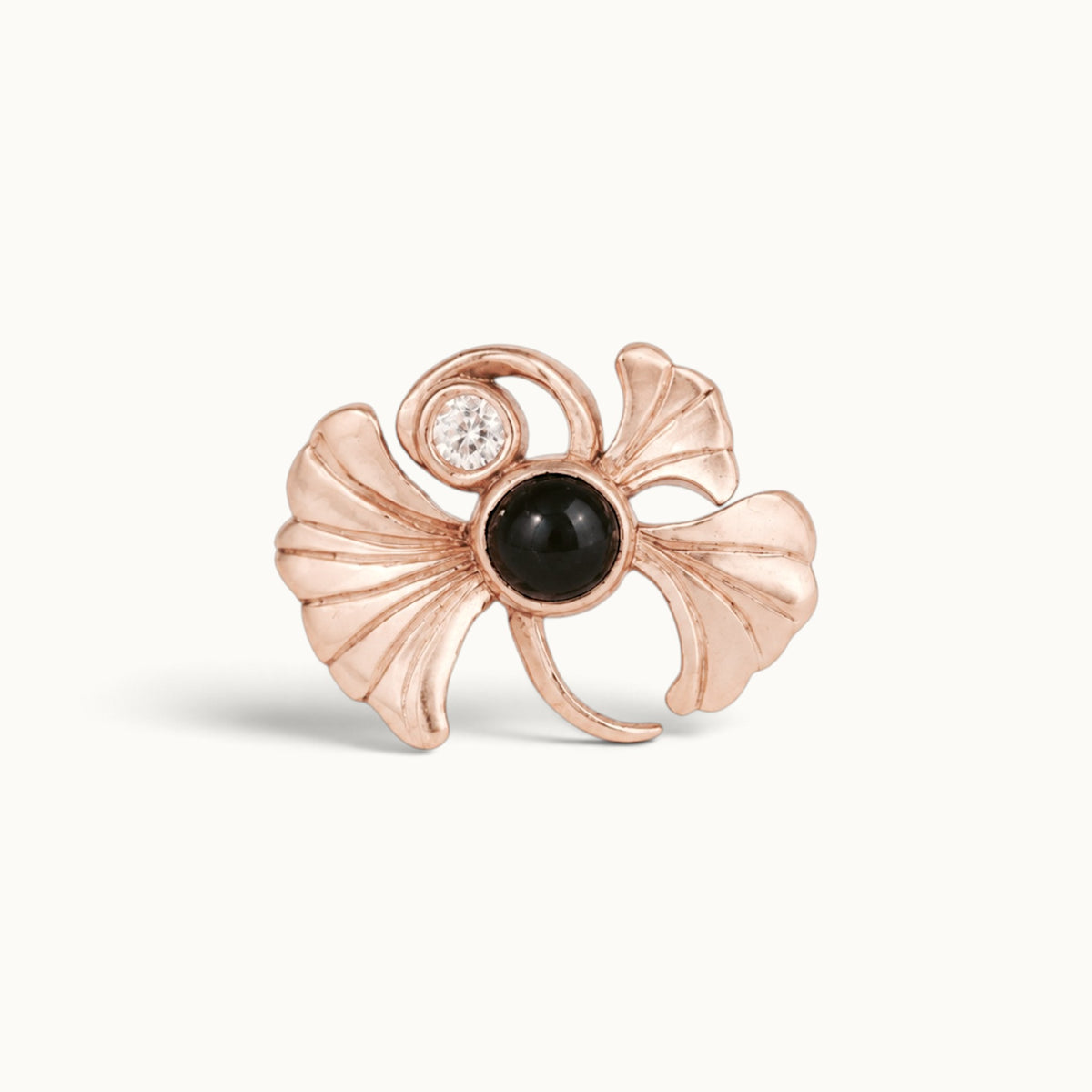 Rose gold ginkgo leaf piercing jewelry with black onyx and diamond