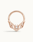 Rose gold seamless hoop piercing jewelry with a pearl and diamonds in a leaf design