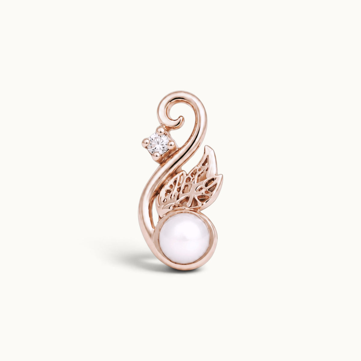 Rose gold swirling leaf piercing jewelry with a white pearl and small diamond