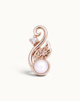 Rose gold swirling leaf piercing jewelry with a white pearl and small diamond