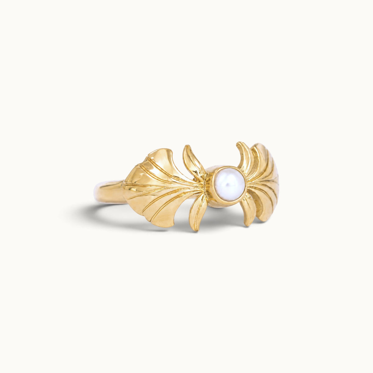 Handmade 18k gold ring with a central pearl and ornate wing-like designs