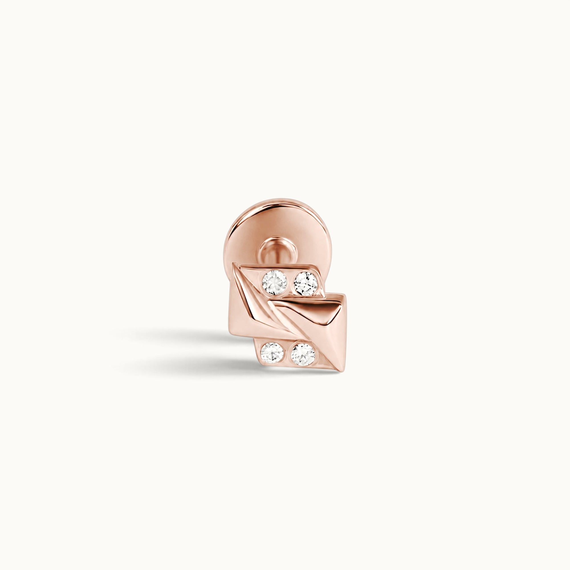 Rose gold ear piercing with four sparkling stones, luxury 18k gold body jewelry for elegant style