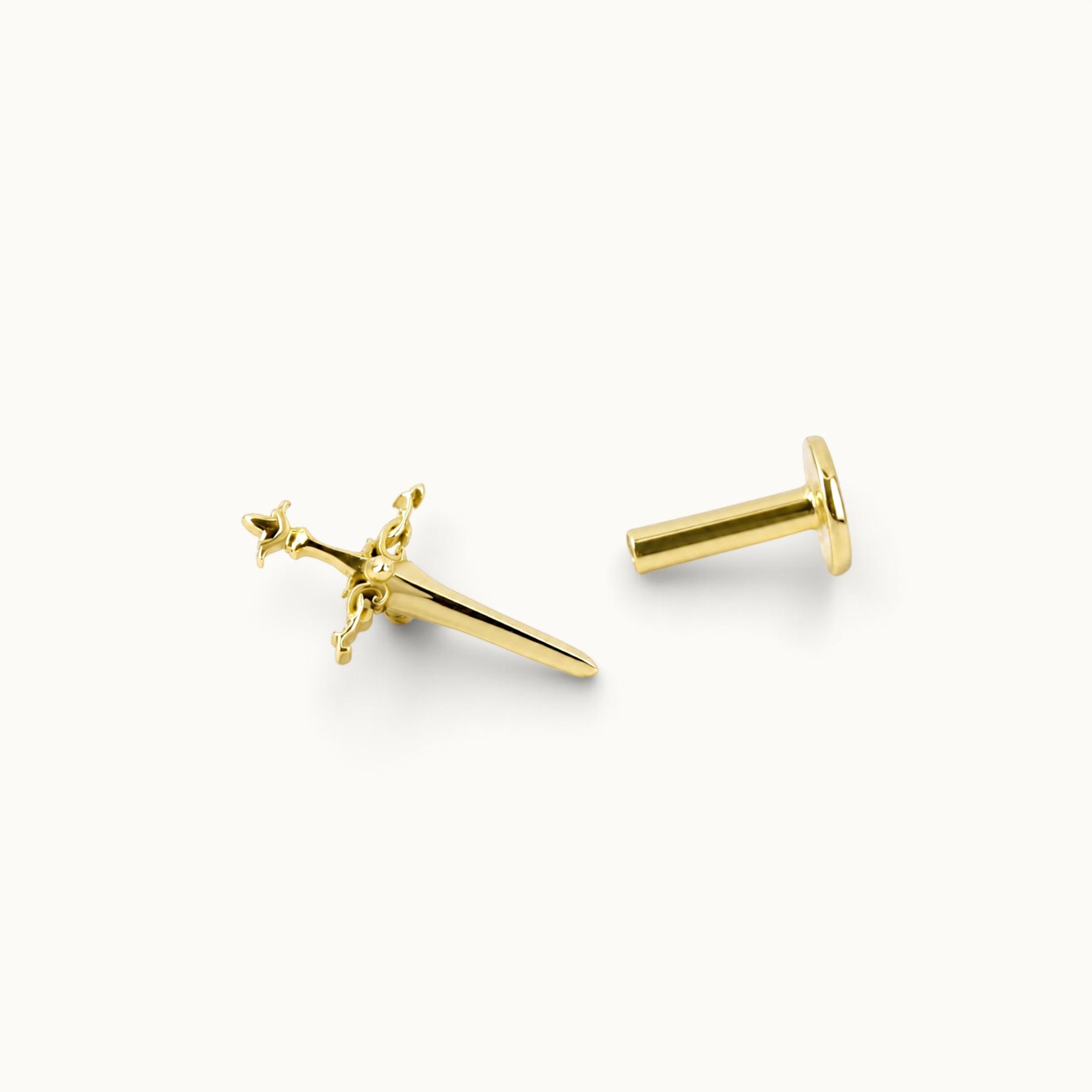 18k gold sword-shaped piercing jewelry with intricate design, luxury body jewelry for ear or nose