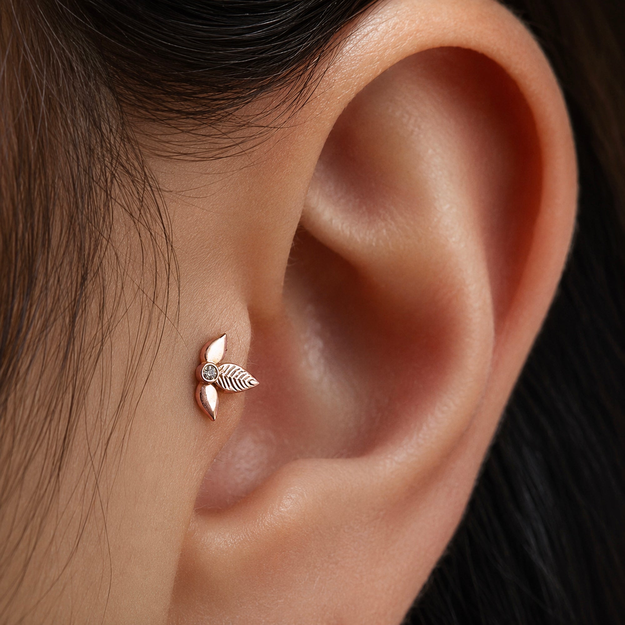 Rose gold leaf ear piercing with diamond accent, luxury 18k gold jewelry for elegant style